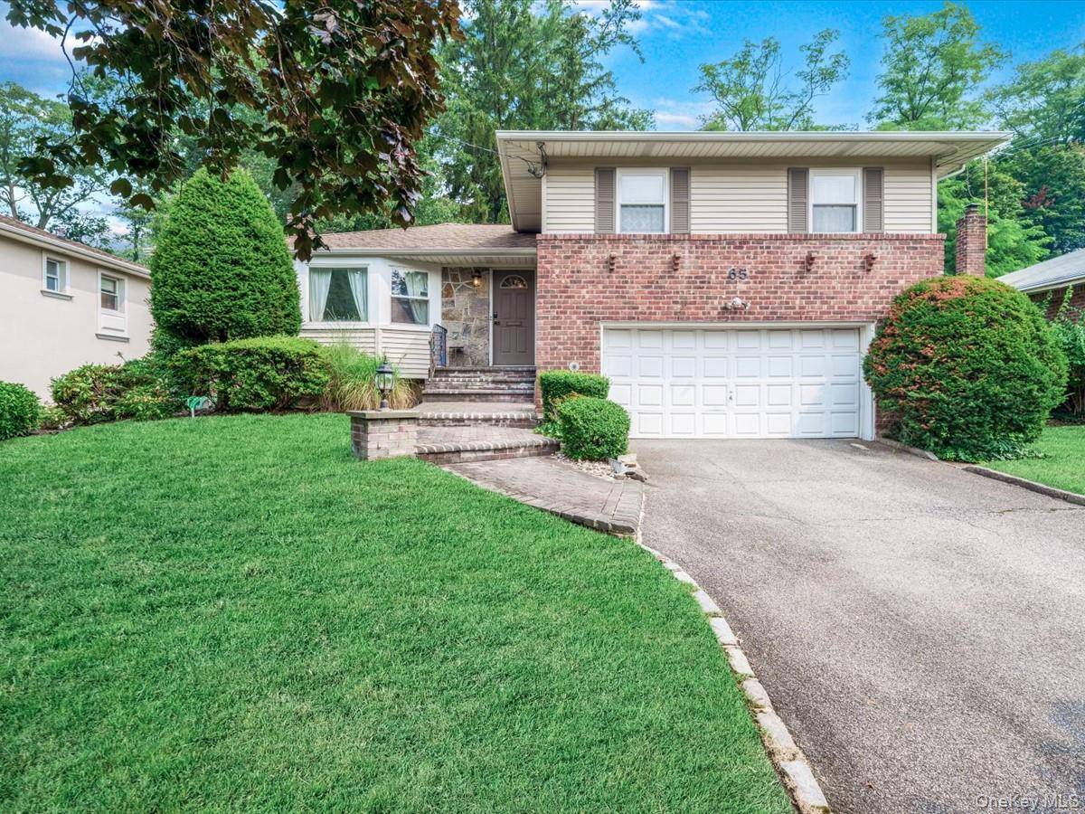 Welcome to this beautiful split level home nestled on a quiet, tree lined street in the Herricks School District.