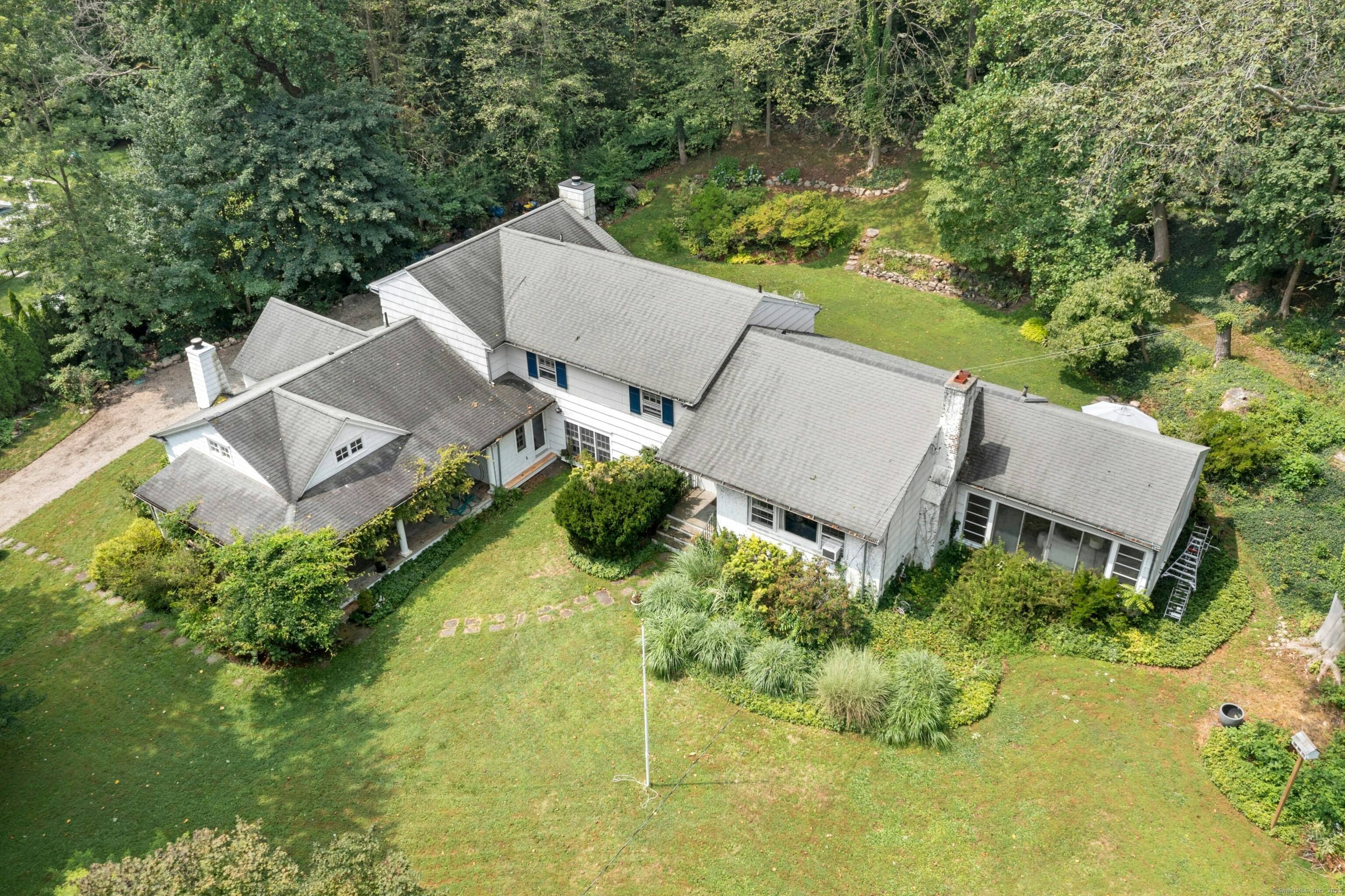Set on a full acre in one of Darien's most sought after neighborhoods, this property presents a rare and versatile opportunity for visionary buyers.