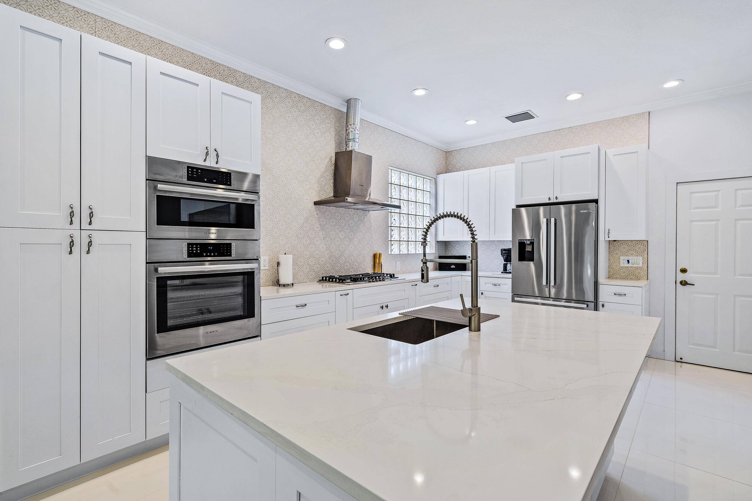 Beautifully renovated and filled with natural light, this bright and airy home features impact windows throughout for peace of mind.