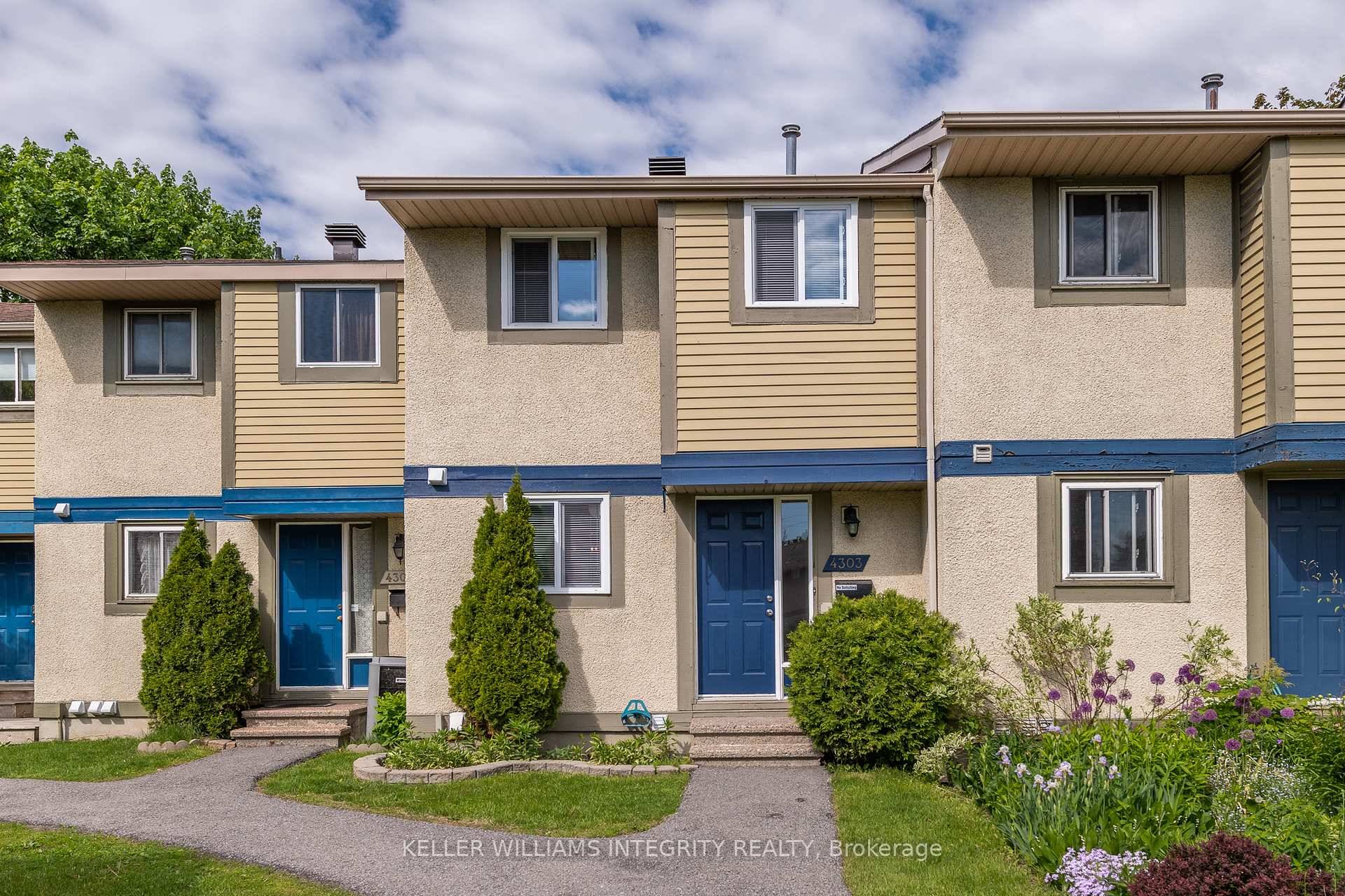 Welcome to this bright, open concept townhome with a private backyard !