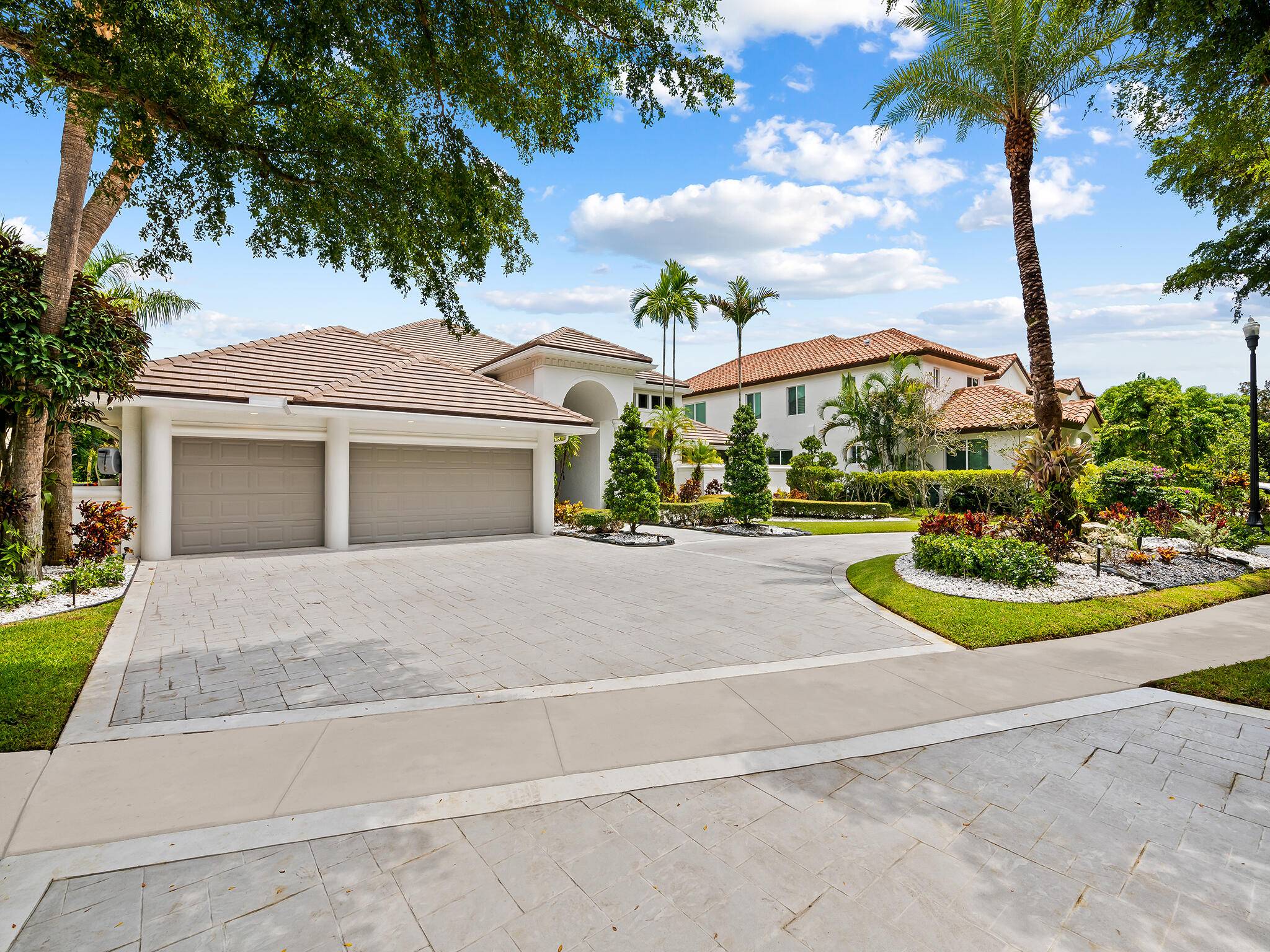 Beautiful east facing ranch style estate on an oversized 14, 000 Sq Ft lakefront lot in the highly sought after manned gated Parkside community.