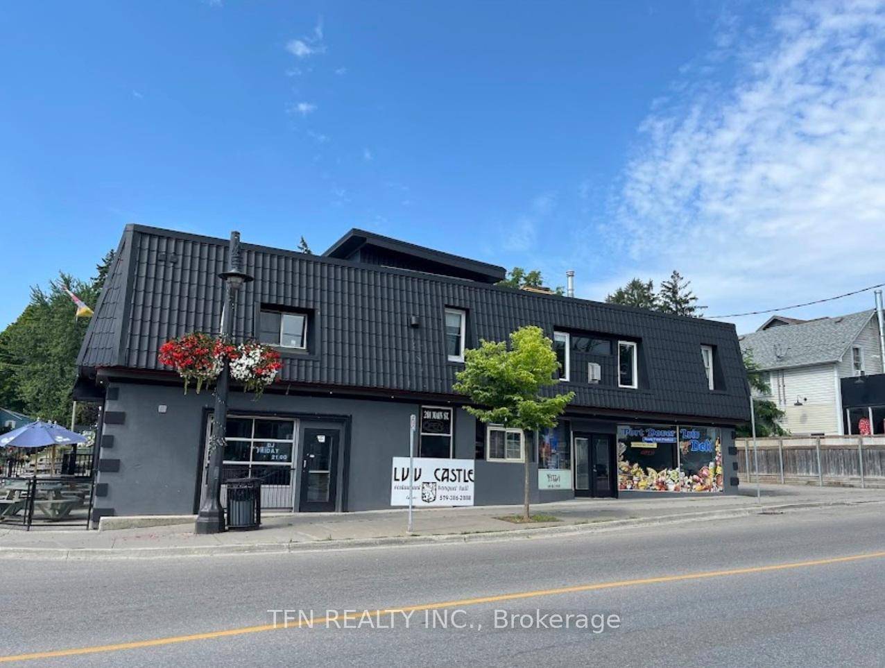Exceptional mixed use property featuring a fully equipped restaurant and deli on the main level, ideally located just steps from high traffic Main Street in the vibrant core of Port ...