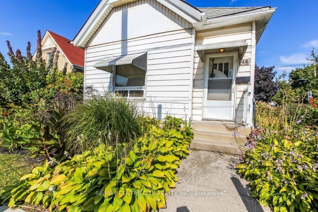 Circa 1905, this bungalow offers 10' ceilings throughout.