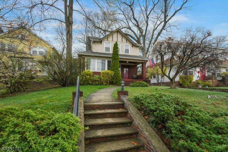 Tudor style brick home with an open floor plan and a spacious two car garage.