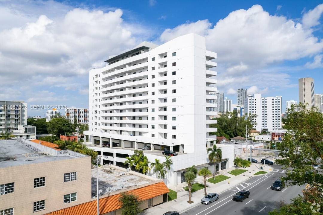 Spacious unit featuring elegant vinyl flooring and a private balcony with breathtaking views of Miami and Brickell.