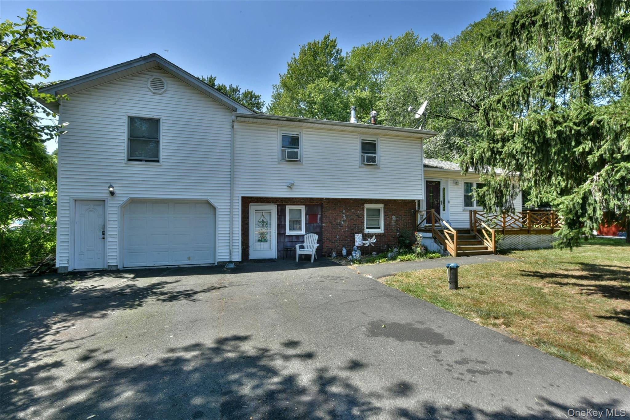 Bedrooms galore ! With five bedrooms and three full bathrooms, this expanded split level home has all the space you need to move in and make it your own.