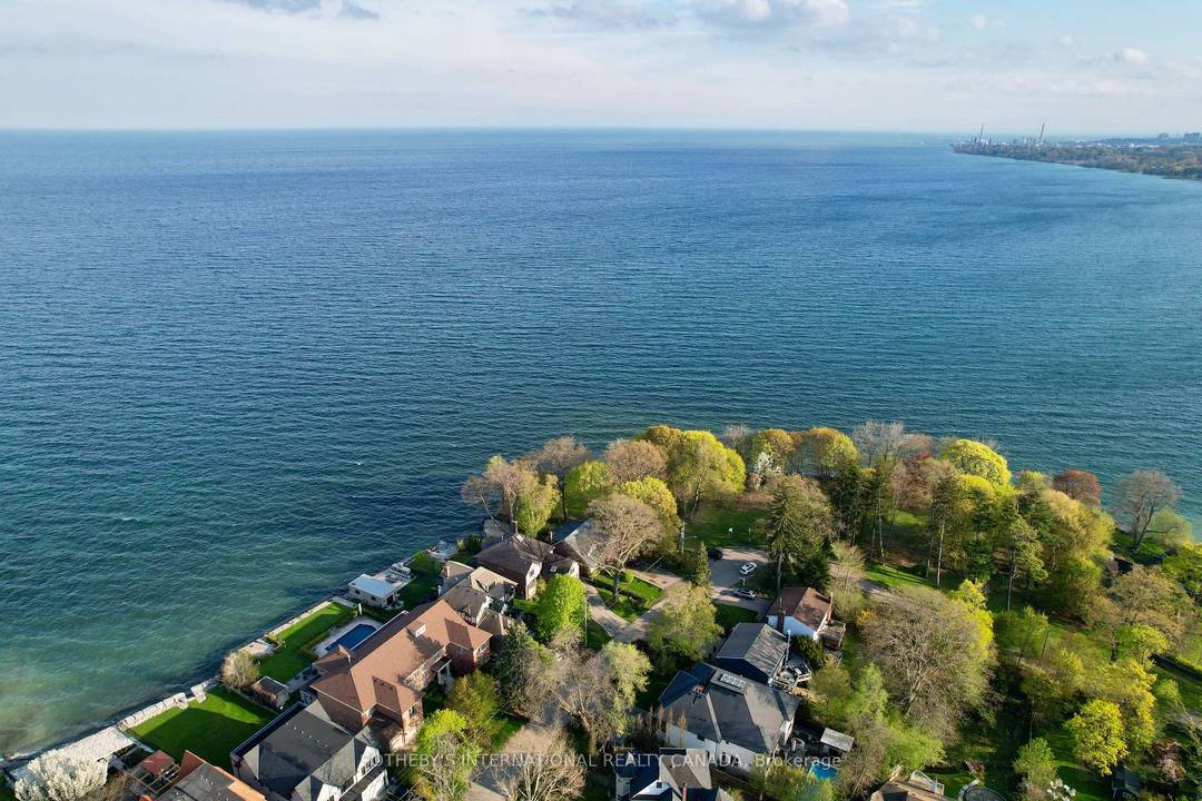 Tucked away on a quiet cul de sac in the heart of prestigious Port Credit, this exceptional residence offers an extraordinary combination of privacy, tranquility, and breathtaking natural beauty.