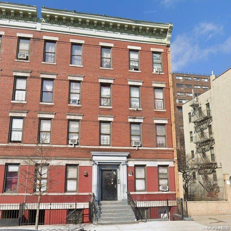 Brick Multi family property with a total of 9 units including a 2 bedroom basement apartment.
