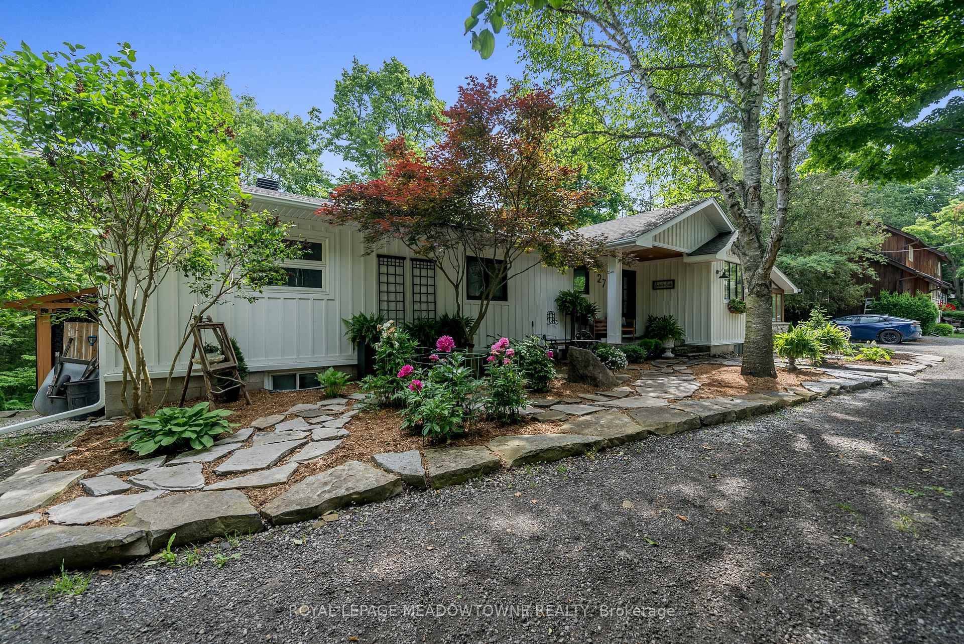 Welcome to this beautifully reimagined 4 bedroom home, privately nestled along a quiet gravel lane in the scenic village of Glen Williams.