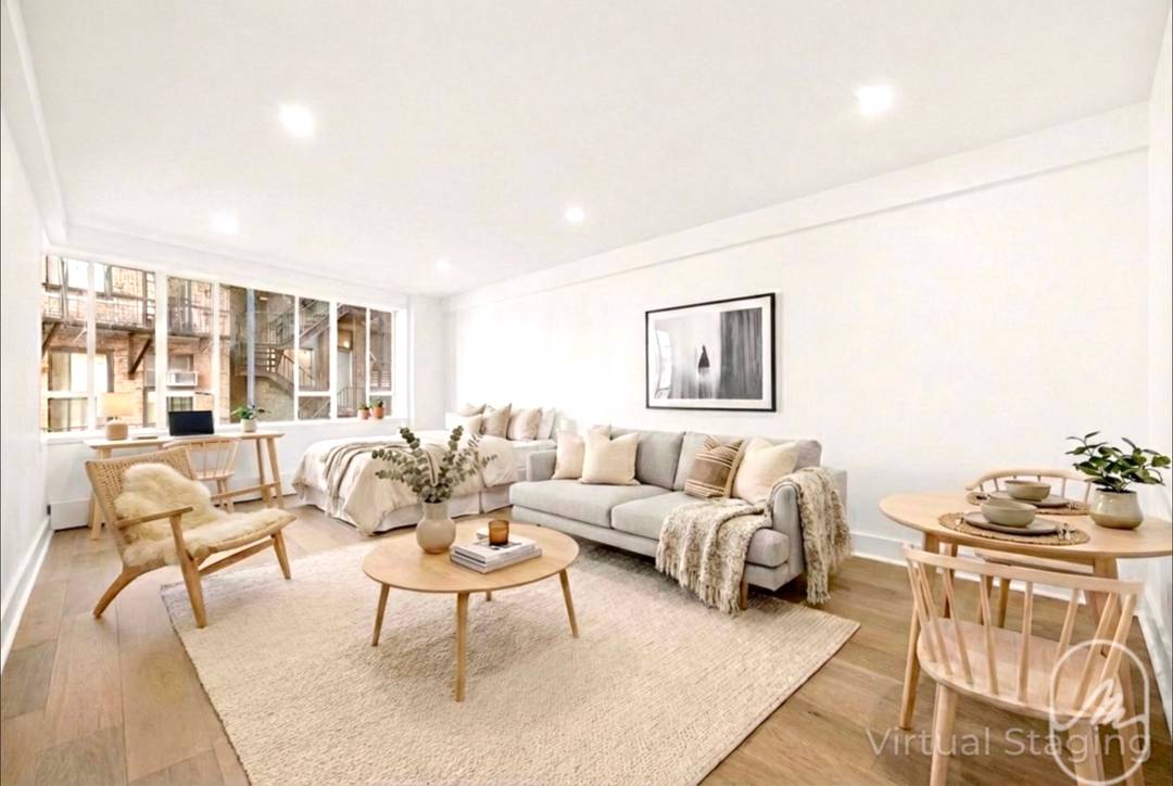 Located on a tree lined block in Greenwich Village, this quiet northwest corner studio features a bright wall of windows and tall ceilings.