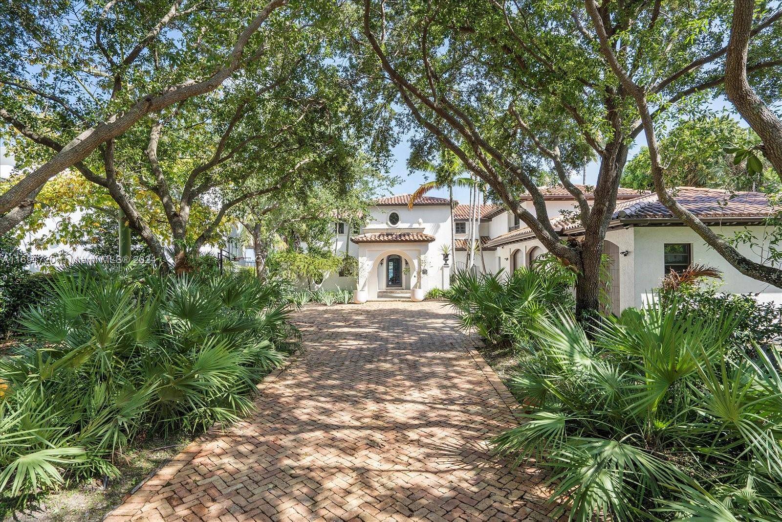 Luxurious waterfront living awaits you in La Grande Dame, a magnificent half acre estate home in the exclusive guard gated Bay Point community.