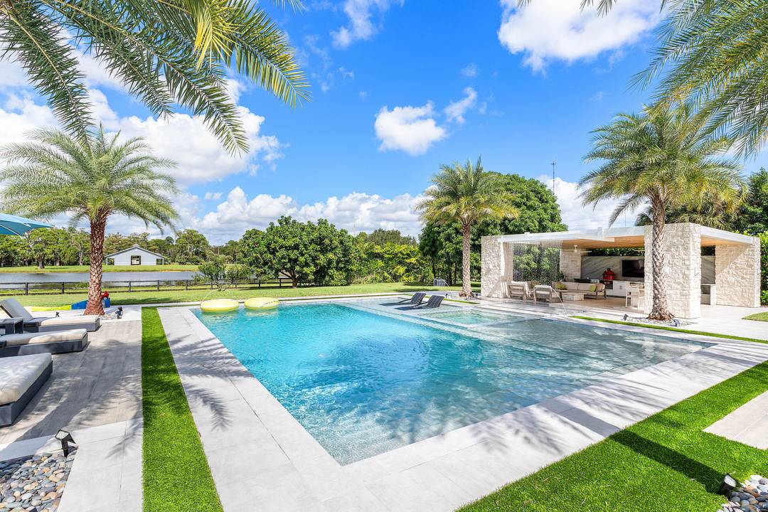 A private 5 acre lakefront estate, custom built and fully furnished, ten to fifteen minutes from Wellington International and the Winter Equestrian Festival showgrounds.