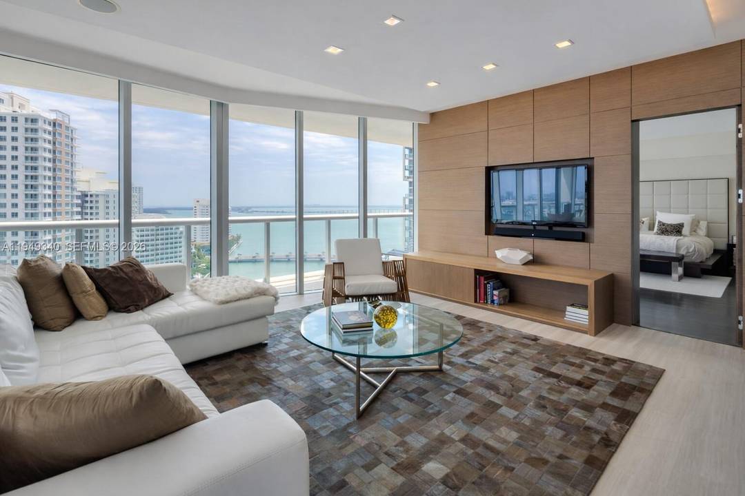 Enjoy panoramic bay and ocean views from this refined, fully furnished residence in the center of Brickell.
