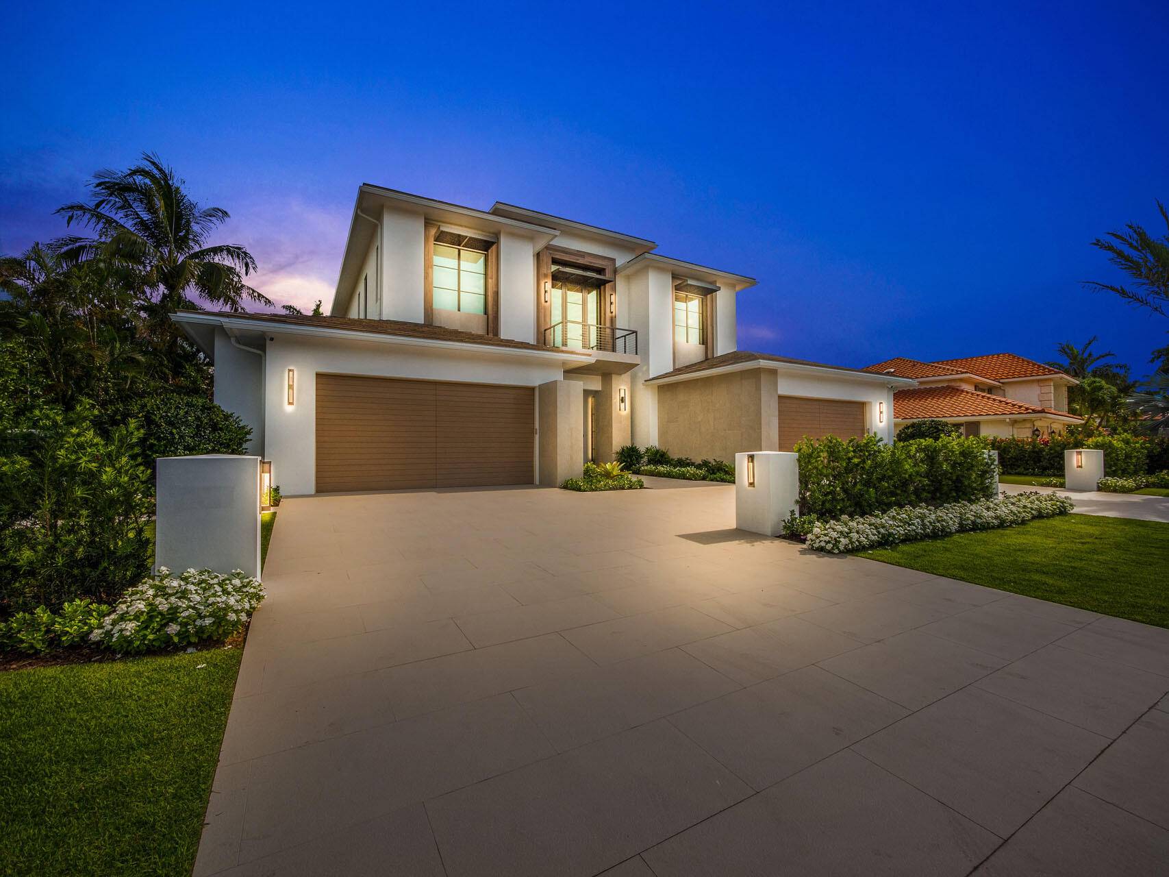 Nestled within the esteemed Royal Palm Yacht Country Club, this exceptional residence, crafted by renowned Bloomfield Construction Inc.