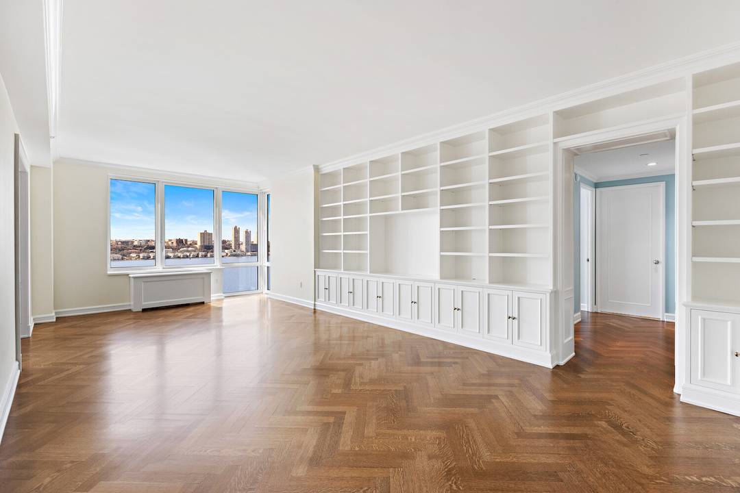 Pristine, fully renovated apartment with sweeping Hudson River and city views.