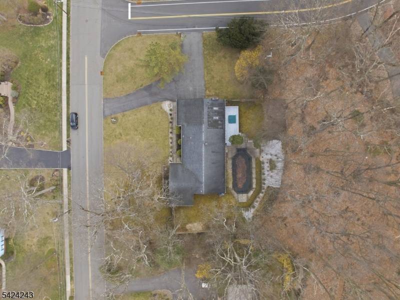 Sprawling 4 bedroom ranch set on a beautiful 1 acre corner lot in one of Denvilles most desirable, quiet neighborhoods.