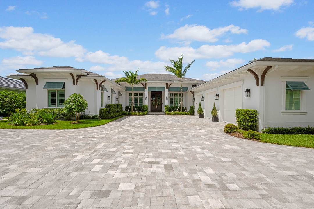 Welcome to 206 Locha Drive, an unrivaled, newly constructed masterpiece in the exclusive Loxahatchee Club, located in the luxury golf capital of the world.