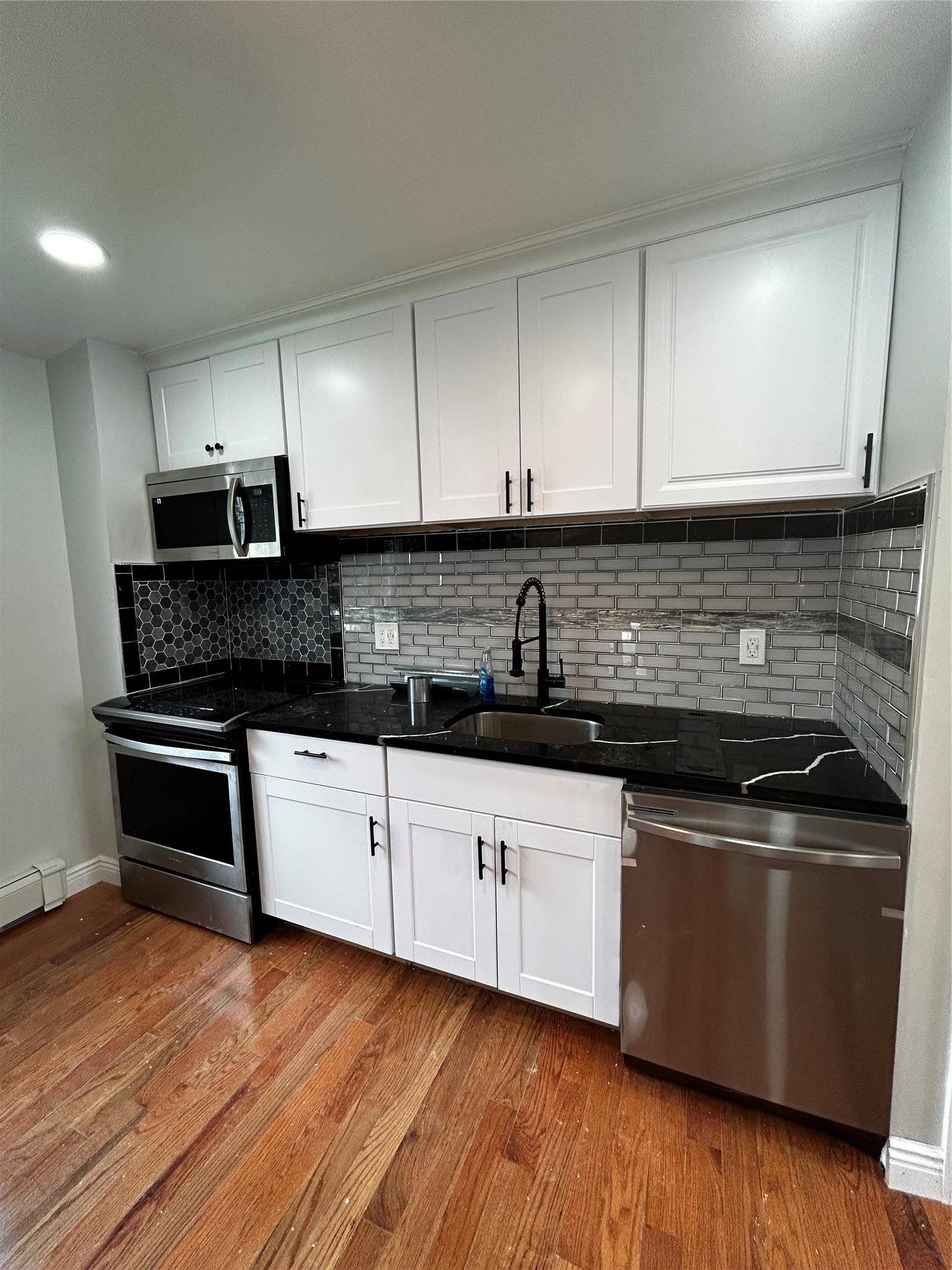 Come see this beautifully renovated 5 bedroom, 2 bathroom hi ranch located in the desirable Elwood School District.
