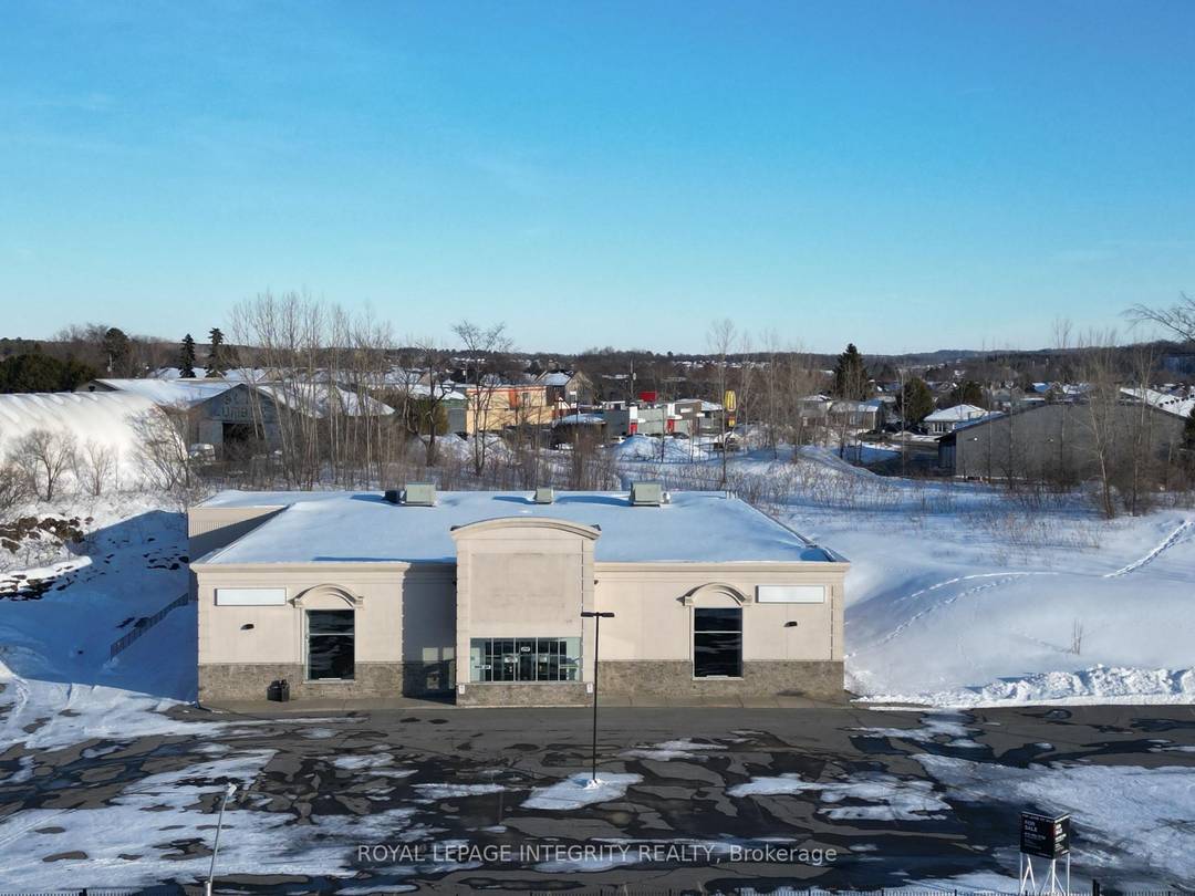 High traffic freestanding retail industrial building on 2.