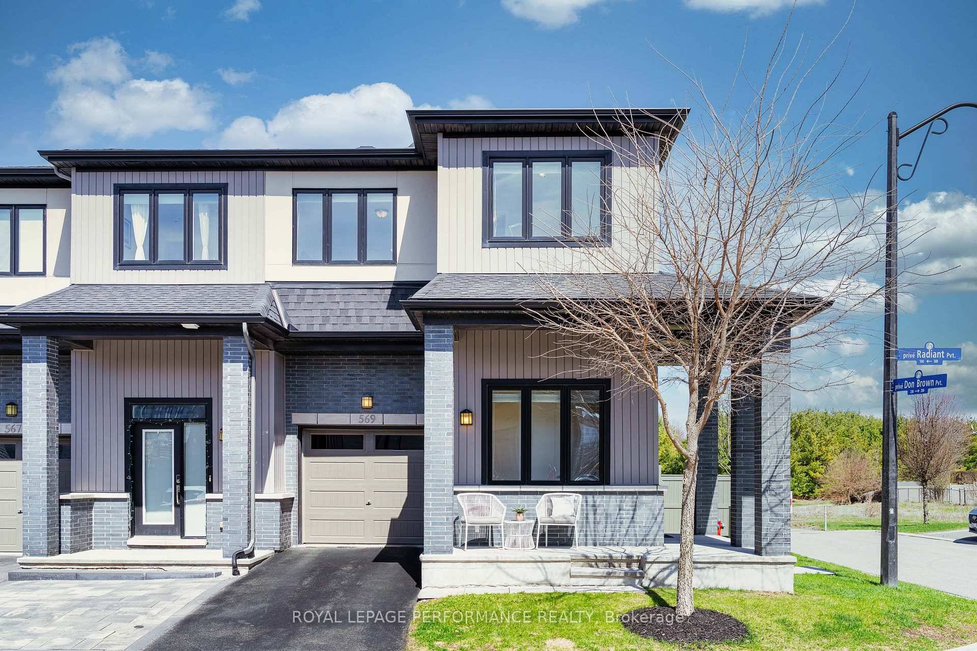 Beautifully situated end unit on a premium corner lot with pond and trail views !