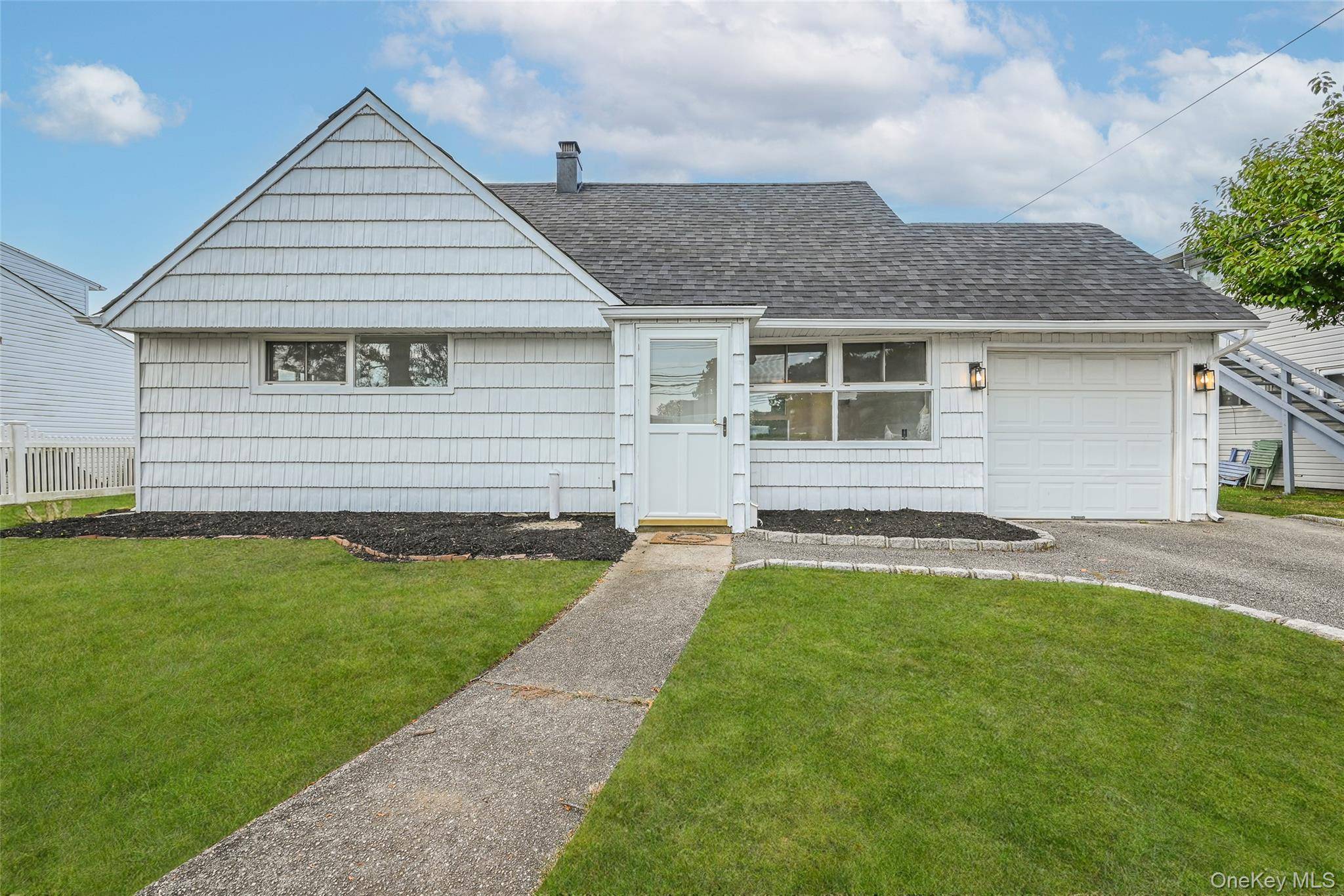 Welcome to this beautifully renovated 4 bedroom 2 bath house in the Salisbury section of Westbury.