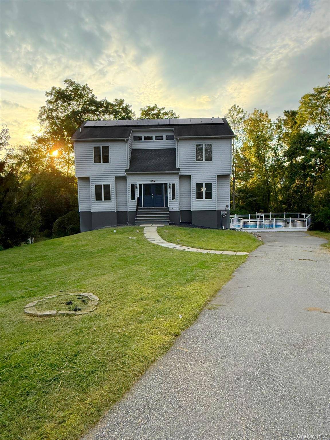Perfectly situated on a serene, elevated lot, this 4 bedroom, 3.