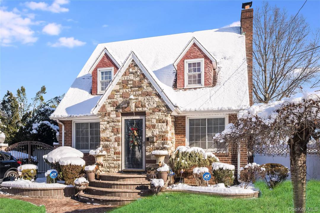 Welcome to 122 Hamilton Road, a captivating Tudor Style Cape nestled in beautiful Duncan Estates.