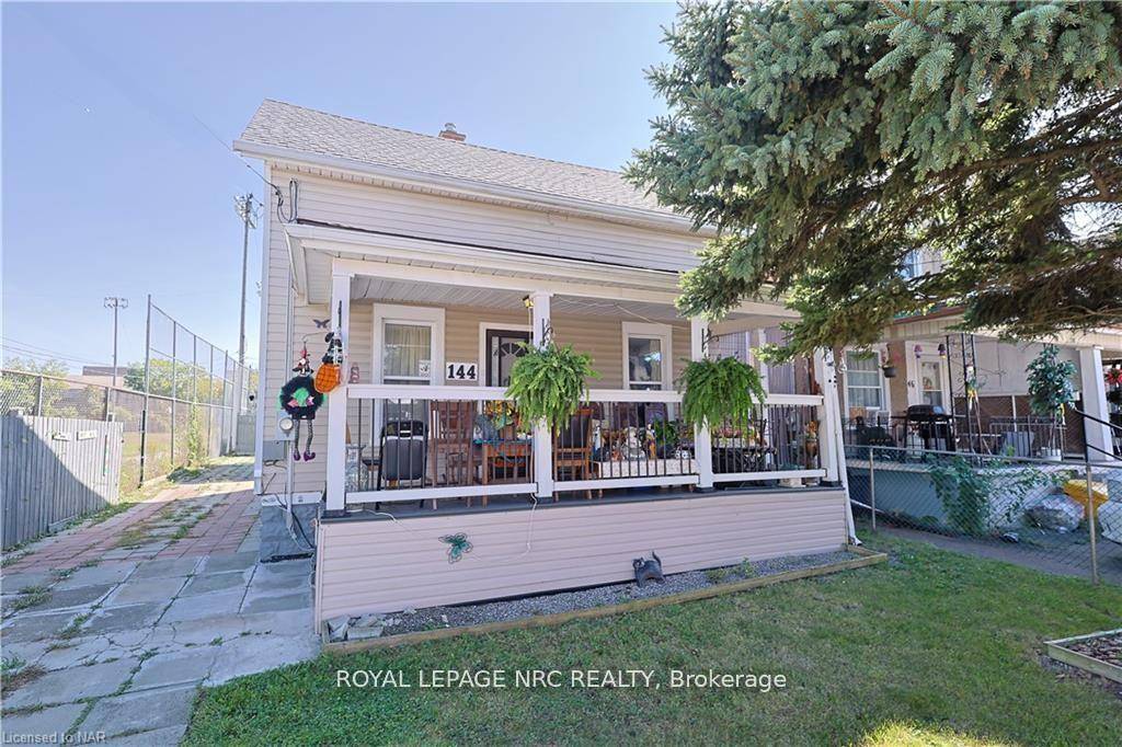 Charming home for sale with no neighbor on one side, offering extra privacy and quiet.