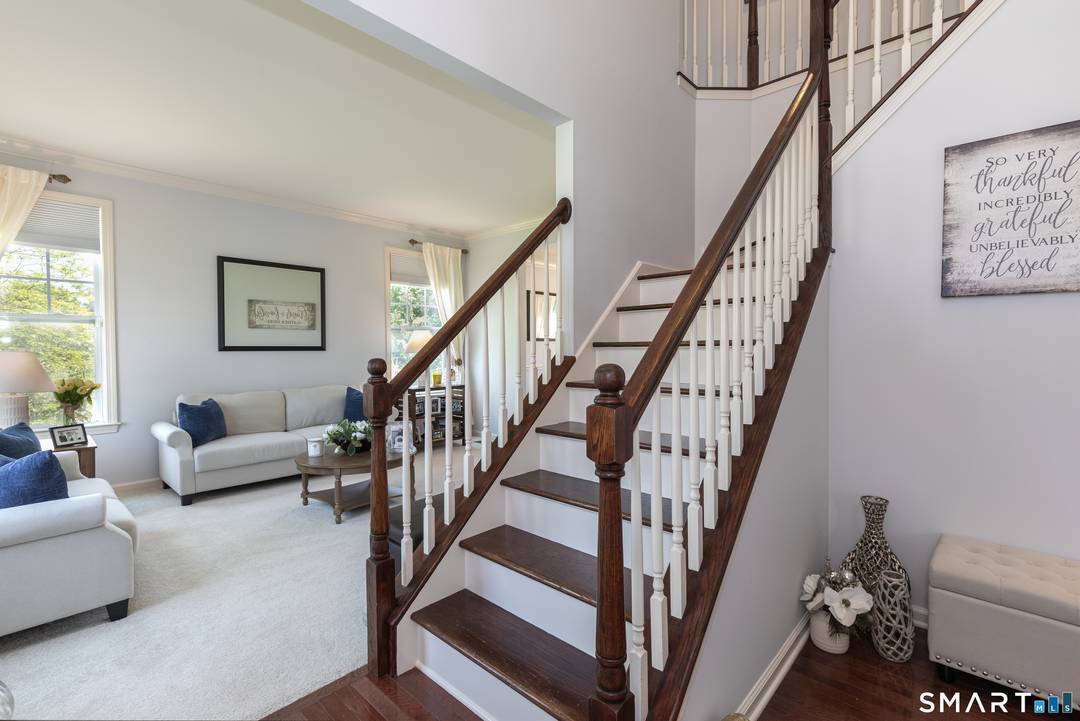 Nestled within the highly sought after Brookside of Middlebury, this exceptional 4 bedroom, 2.