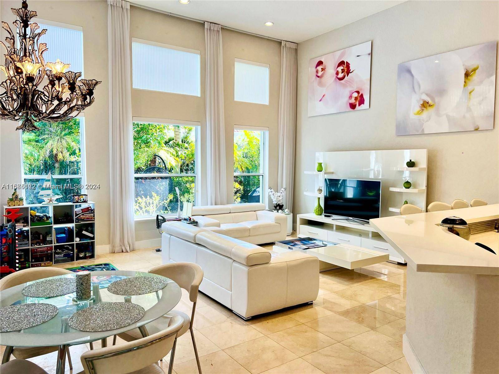 Experience luxury living in this exquisite residence situated within the prestigious Harbor Islands community.