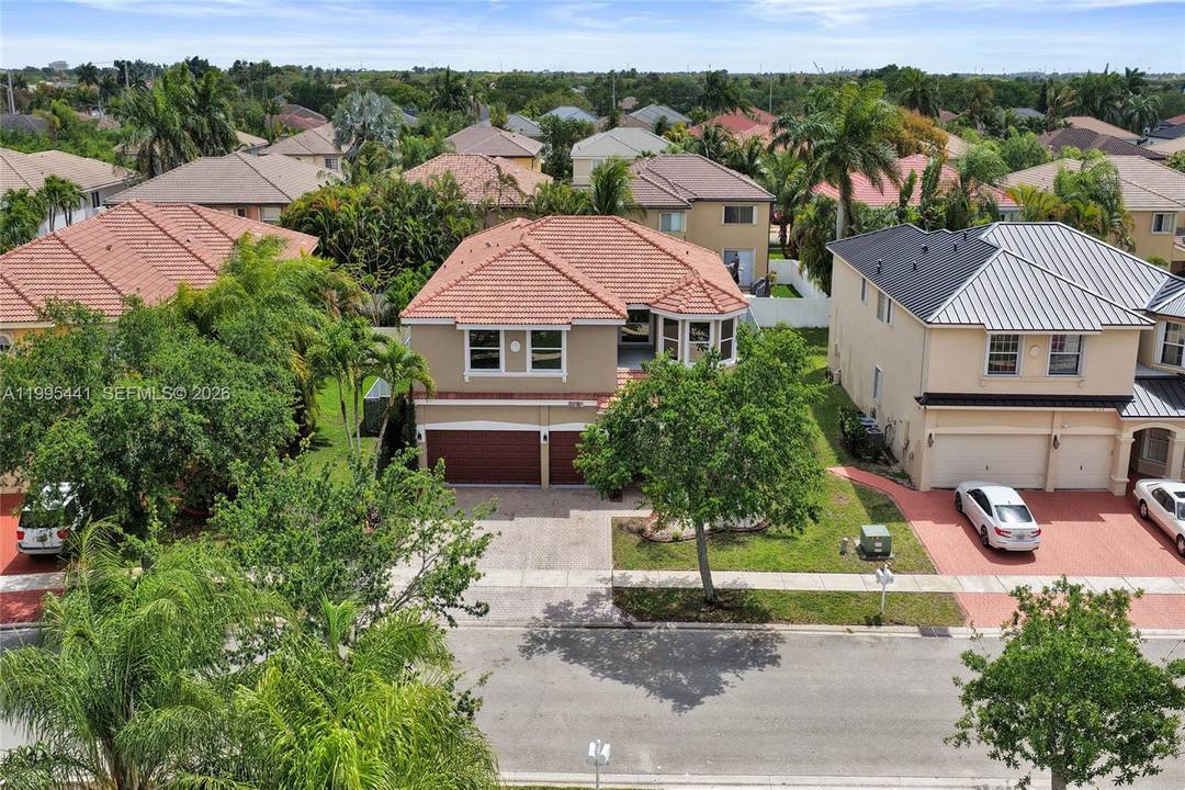 Navigate Home to this 5 bedroom 4 bathroom gated, pool home in the city of Pembroke Pines.