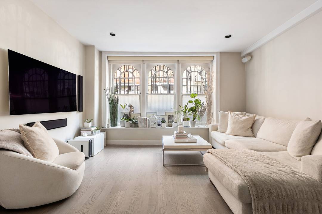 Rarely available, this oversized and mint one bedroom CONDO is in a romantic turn of the century townhouse on quiet Noho East Village block.