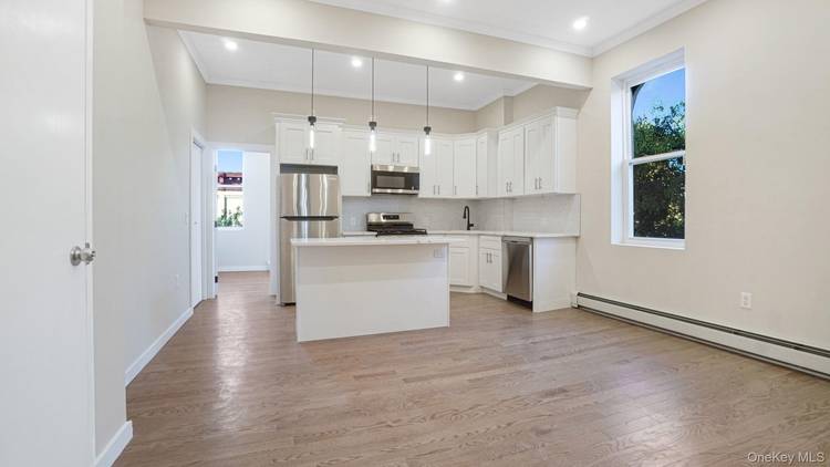 Welcome home to this beautifully renovated three bedroom, two bath residence that perfectly combines modern design, comfort, and warmth.