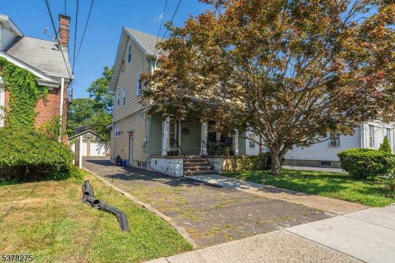 Welcome to this charming Colonial in desirable Belleville Township, offering a perfect blend of classic character and modern updates.