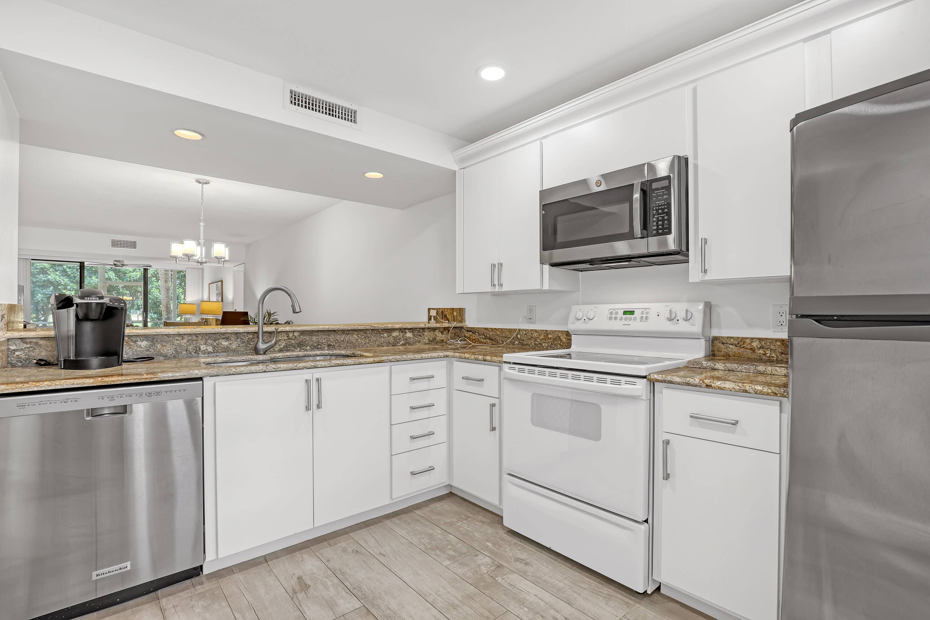 No stairs or elevator are required to enjoy this sought after, first floor corner unit.