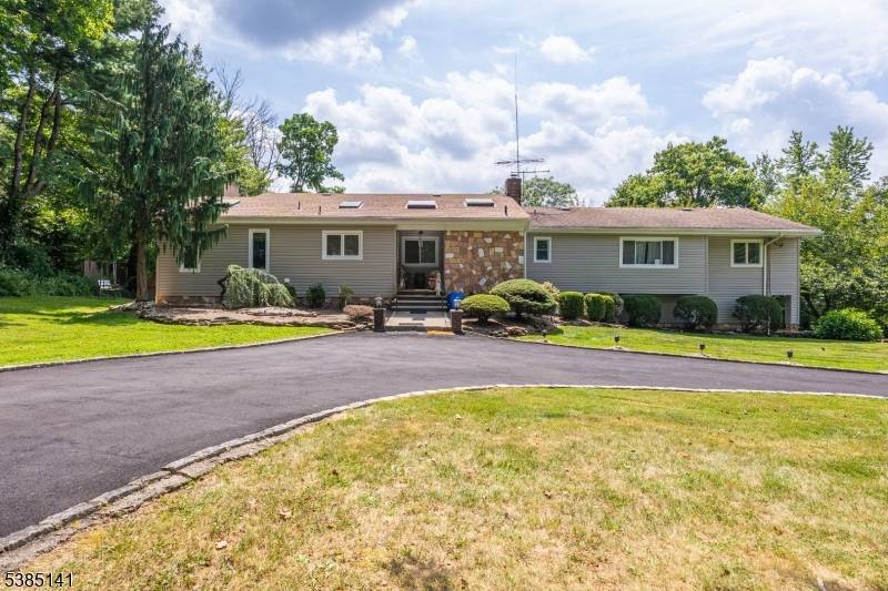 Upscale raised ranch retreat in desirable Berkeley Heights, perfect for large gatherings or entertainers.