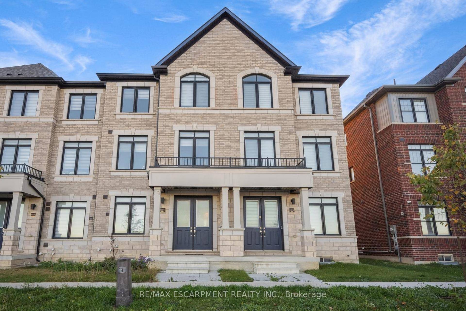 Bright and spacious 3 storey townhome with a basement, featuring 3 bedrooms, 2 2 bathrooms, a double garage, and inviting outdoor space !