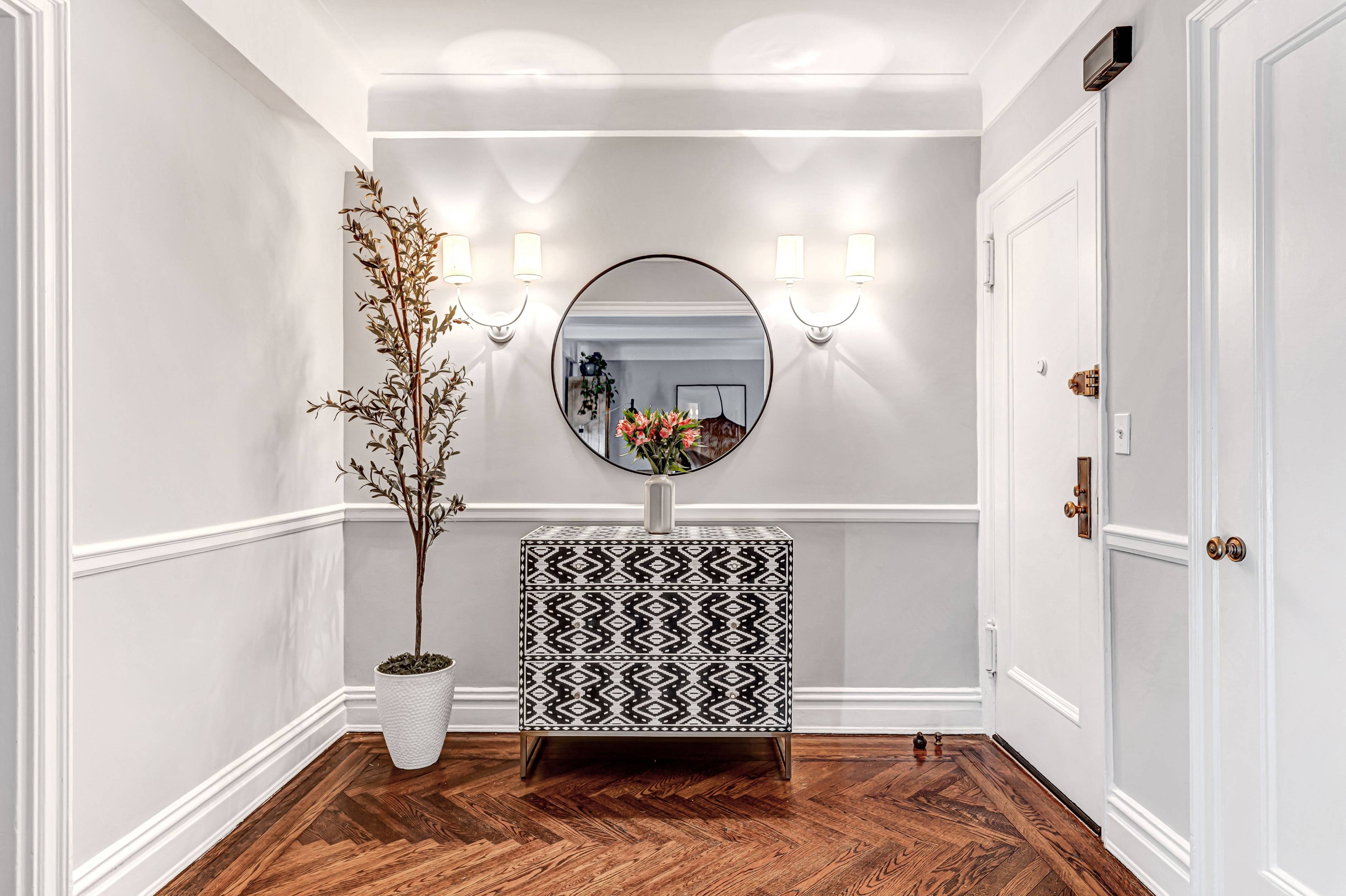 Move right into this pristine two bedroom, one and one half bathroom residence where a stylish renovation elevates classic prewar details to cultivate an atmosphere of timeless sophistication.