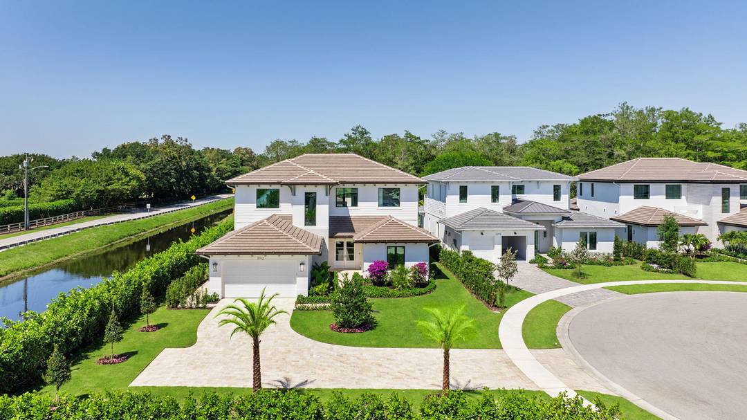 Discover elevated living in this custom built estate located in the prestigious Palm Beach Polo community.