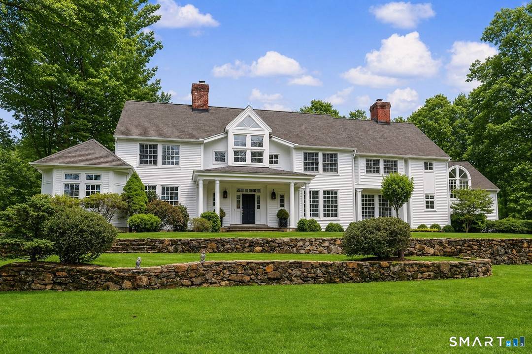 Welcome to 66 Gate Stone Lane, a quintessential Connecticut estate in the heart of historic Greenfield Hill.