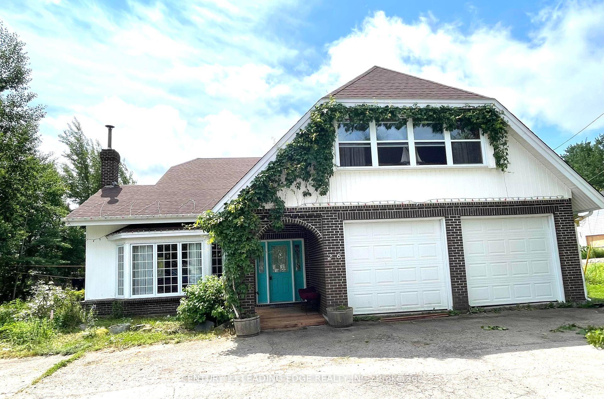 Stunning Tudor Style Home on Nearly 2 Acres in Hare Bay, NL A Nature Lovers Paradise !