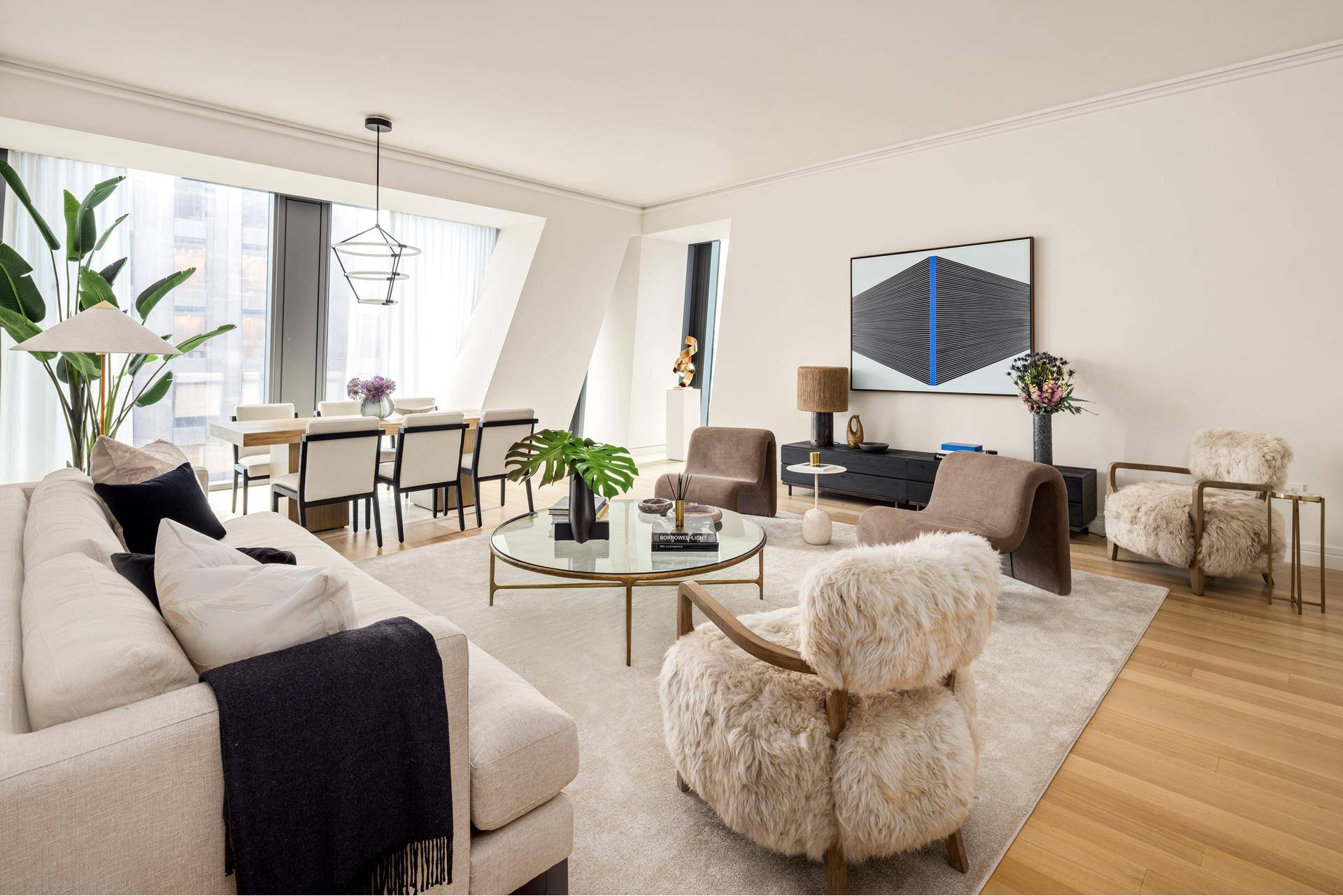 Combining superb sophistication and craftsmanship with the intimate feeling of home, Residence 34C at 53 West 53 comprises 2, 506 square feet, offering three bedrooms, three and a half bathrooms, ...