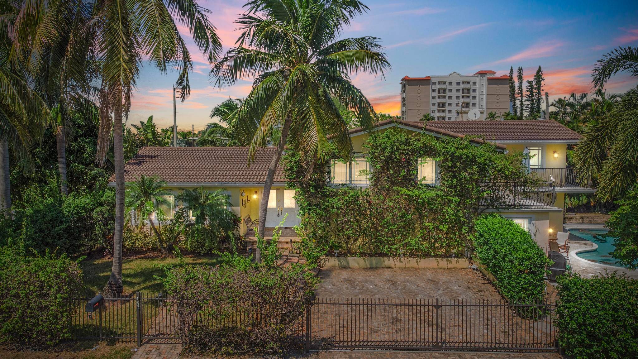 Experience the pinnacle of coastal living in this exquisite 4 bedroom, 4 bathroom residence, perfectly positioned just one block from the sun kissed sands of the beach.