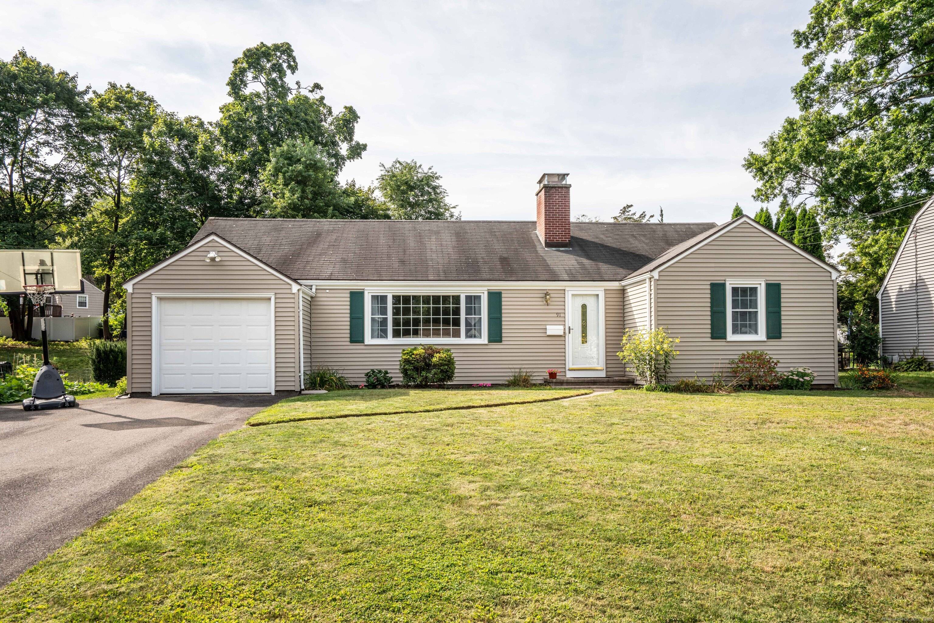 Nestled in the center of Newington, this charming ranch has everything you want !