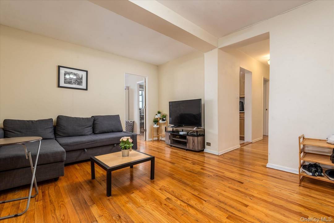 Welcome to this charming and inviting 2 bedroom co op located in the heart of vibrant Woodside.