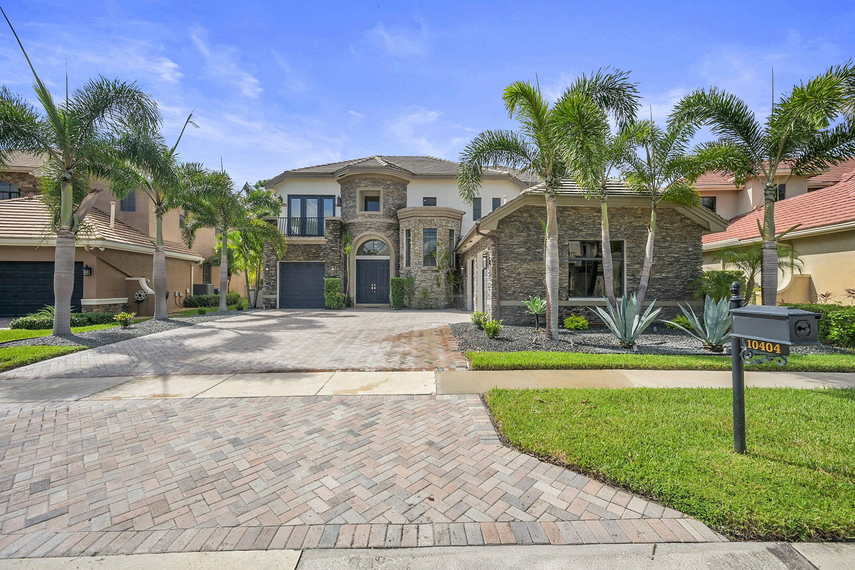 Welcome to this beautifully upgraded 6 bedroom, 6 bathroom estate in the prestigious Versailles community.