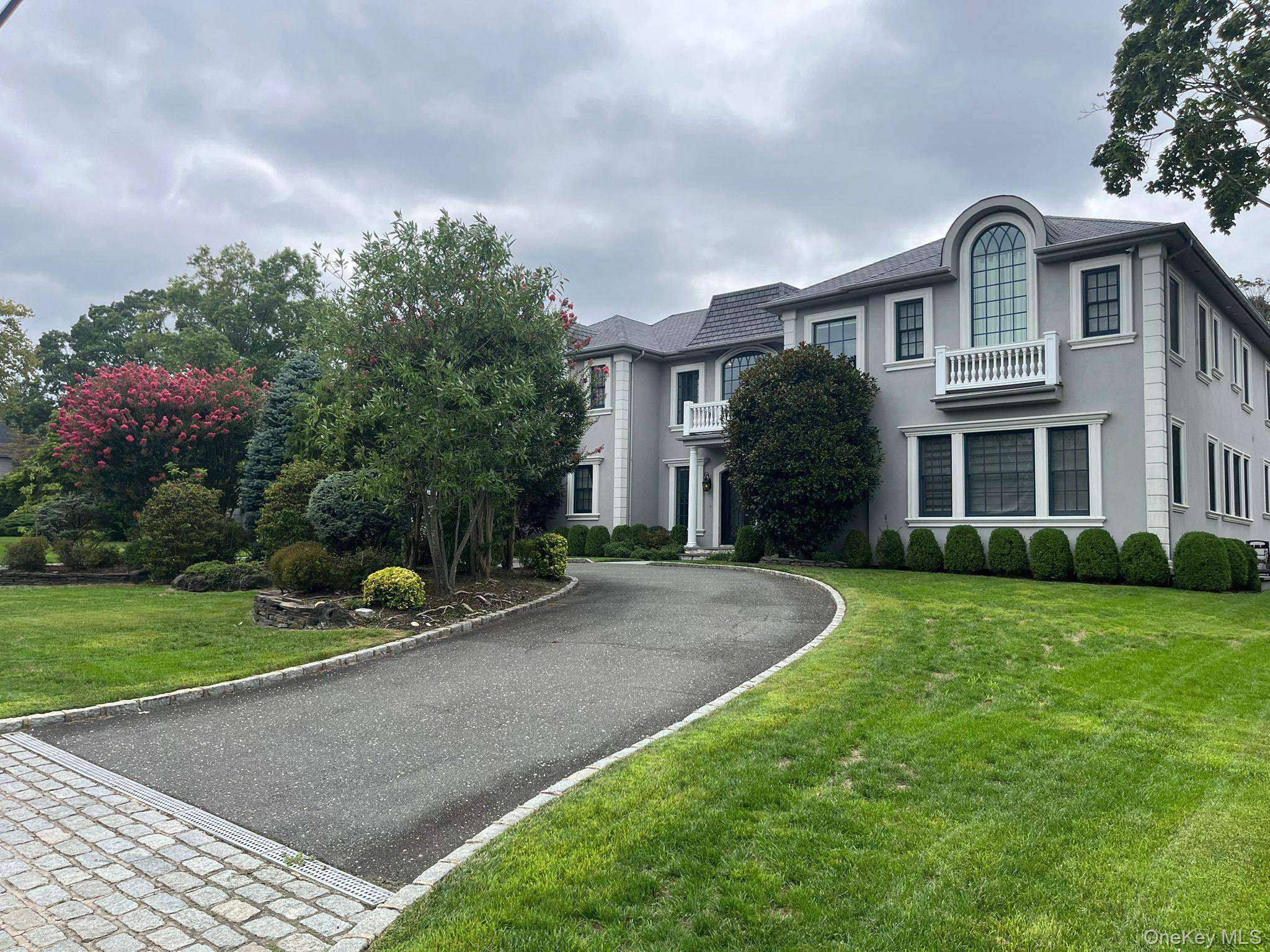 Elegant custom colonial on nearly ¾ acre with pool and outdoor kitchen.