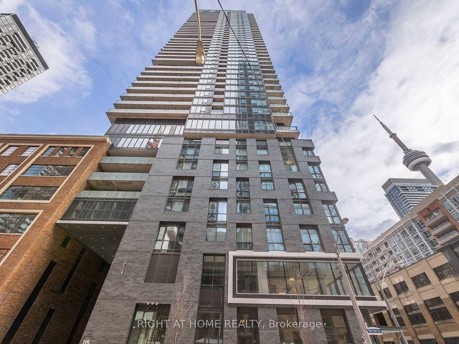 Experience luxury living in this modern 1 bedroom den condo with parking, offering 716 sq.