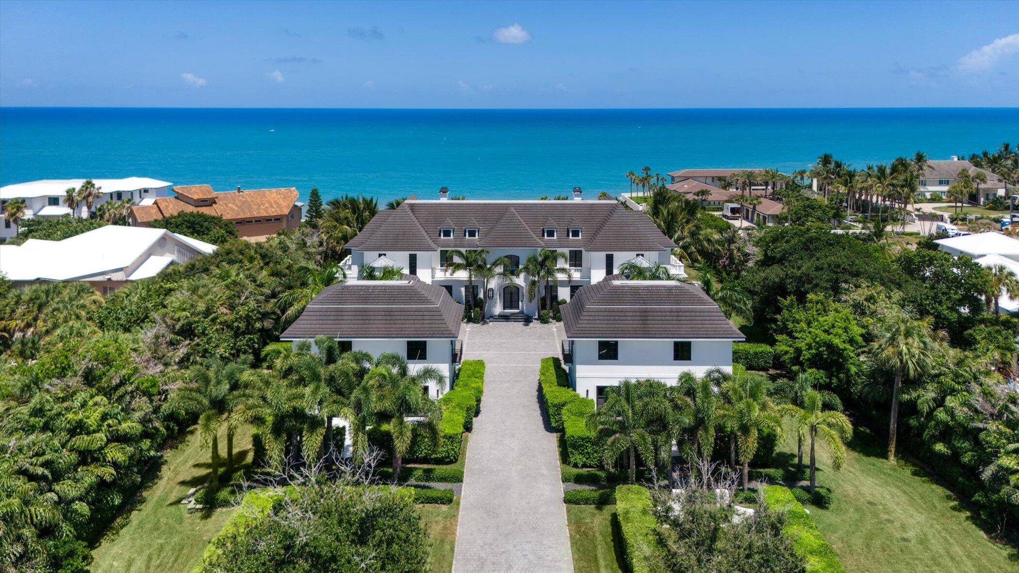 Experience unparalleled luxury at this legacy oceanfront estate on 4.