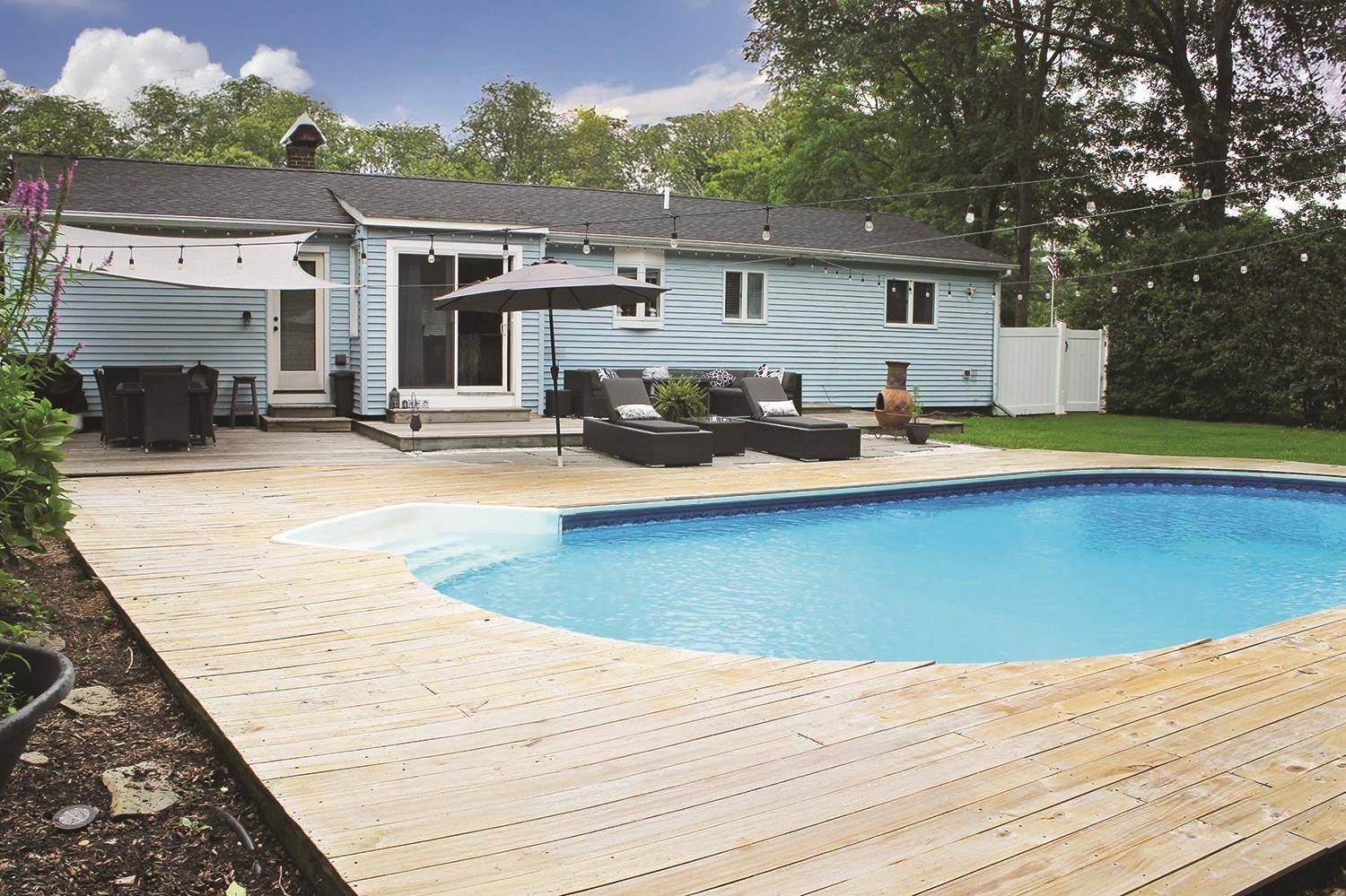 Nestled just moments from the scenic Shinnecock Canal, this impeccably updated ranch offers refined Hamptons living on a beautifully landscaped.